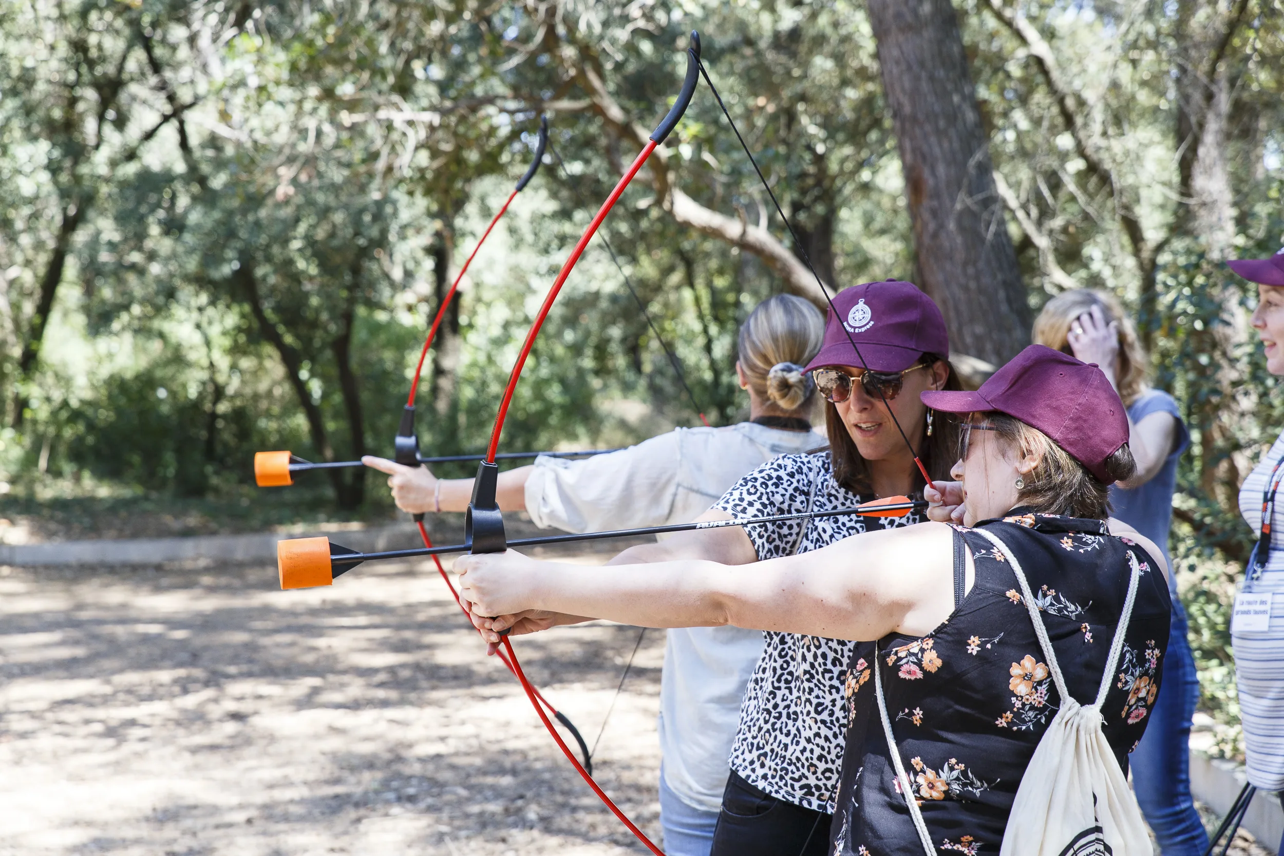 Corporate archery Laval outdoor range riverside park in autumn · INNOV'events event planning