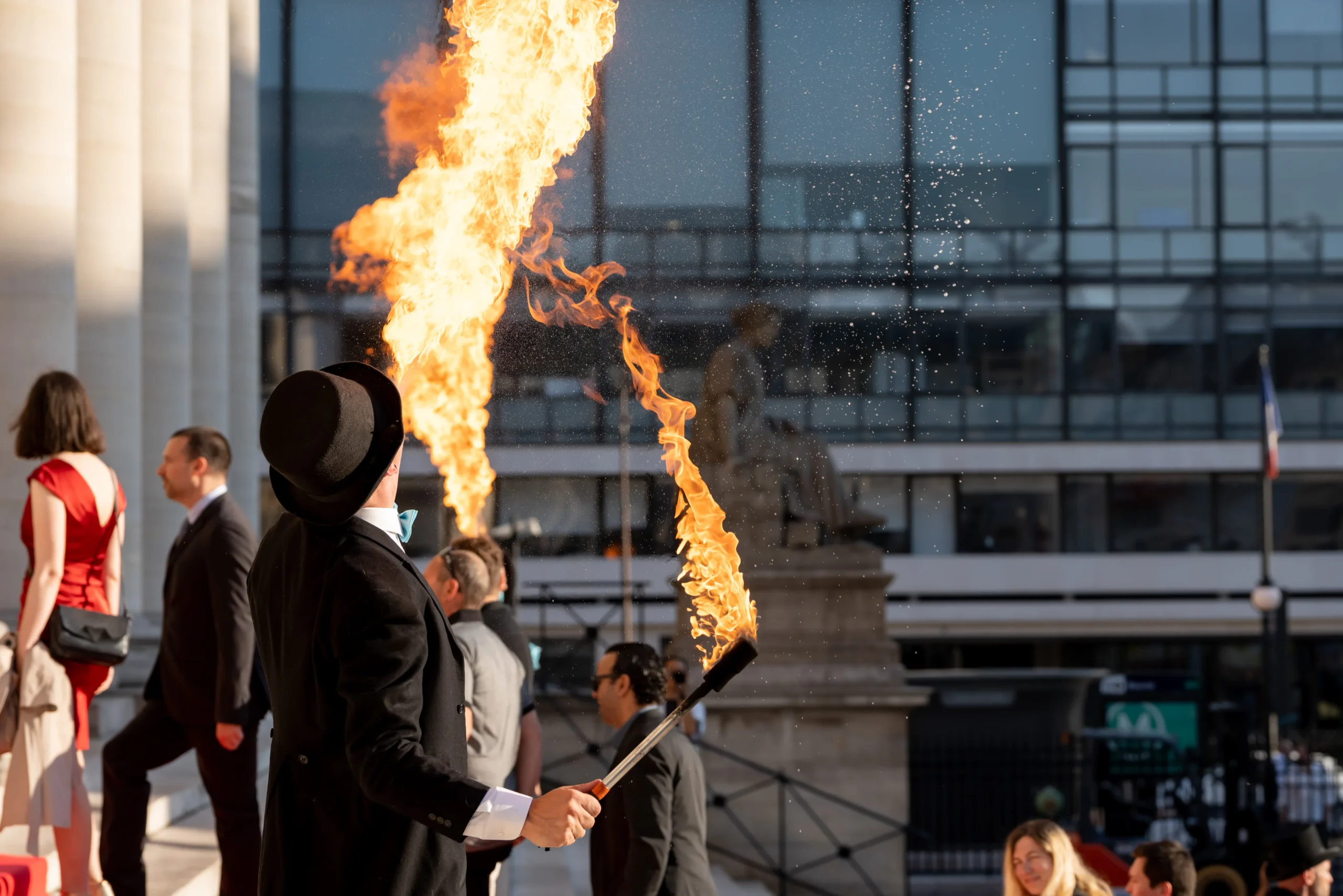 Corporate fireworks in Laval, crowd on illuminated riverbank, summer evening · INNOV'events