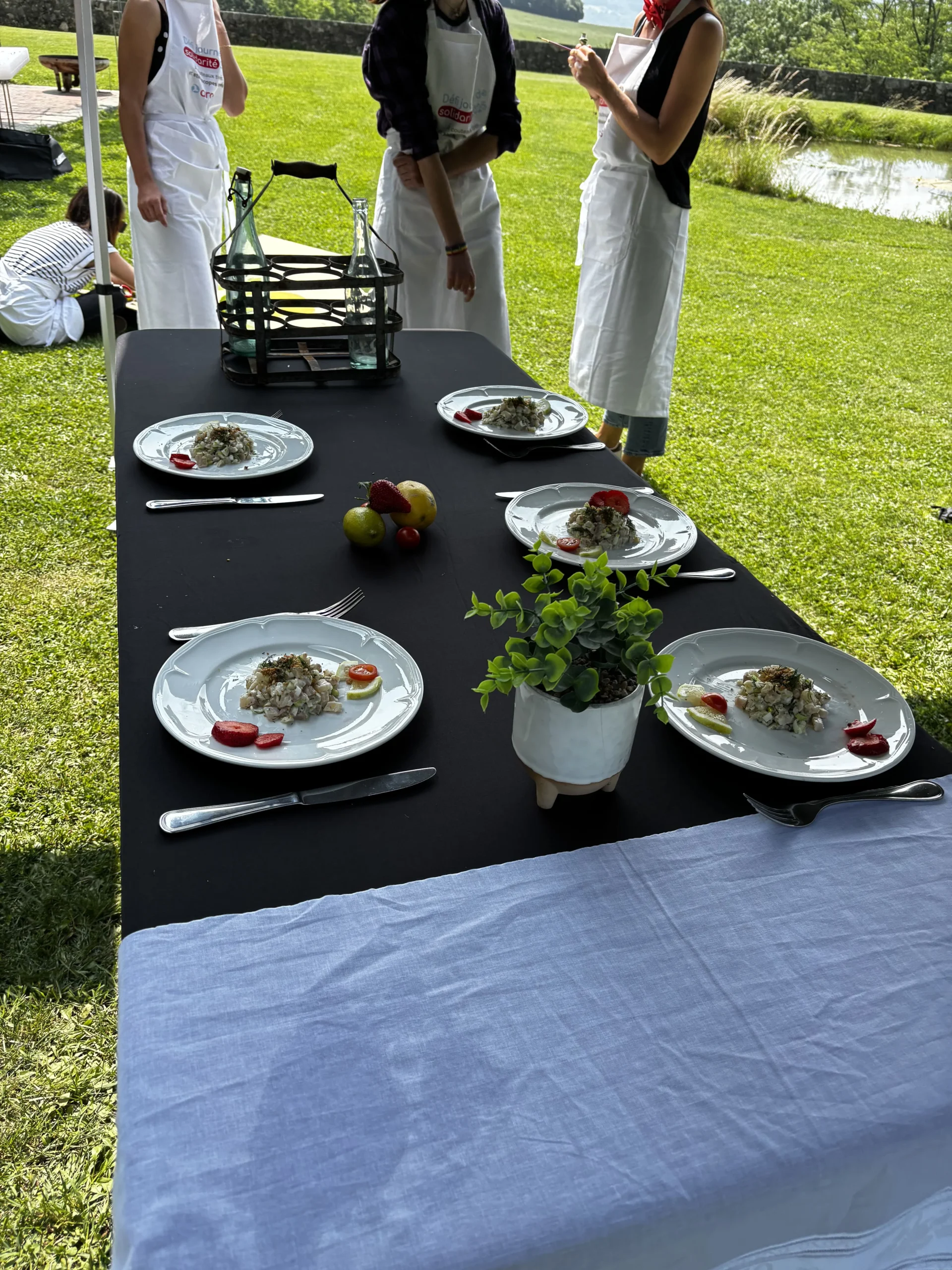 Culinary workshop Montreal teams in aprons open kitchen Mile-Ex · INNOV'events