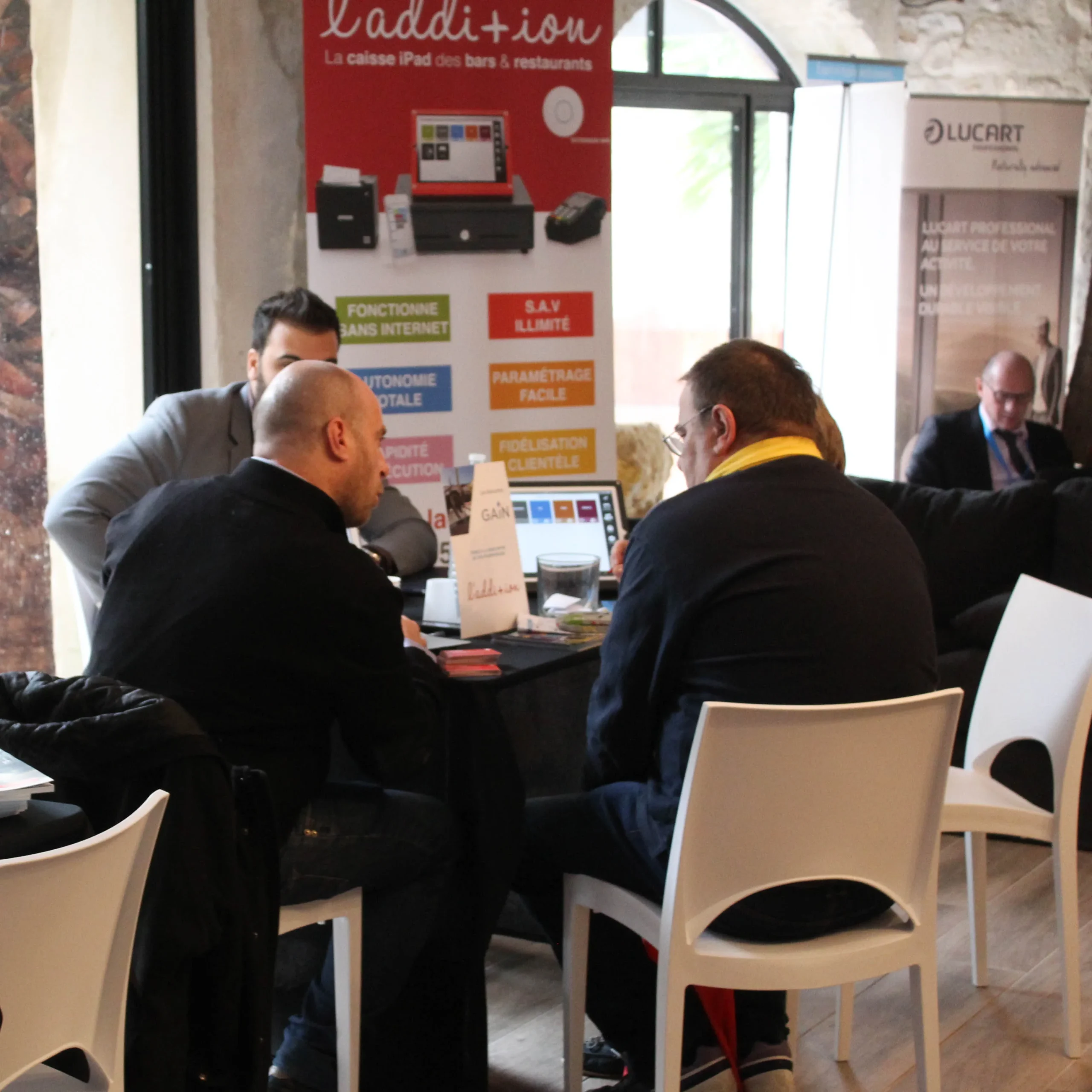 Booth entertainment in Quebec group gathered around an interactive booth · INNOV'events