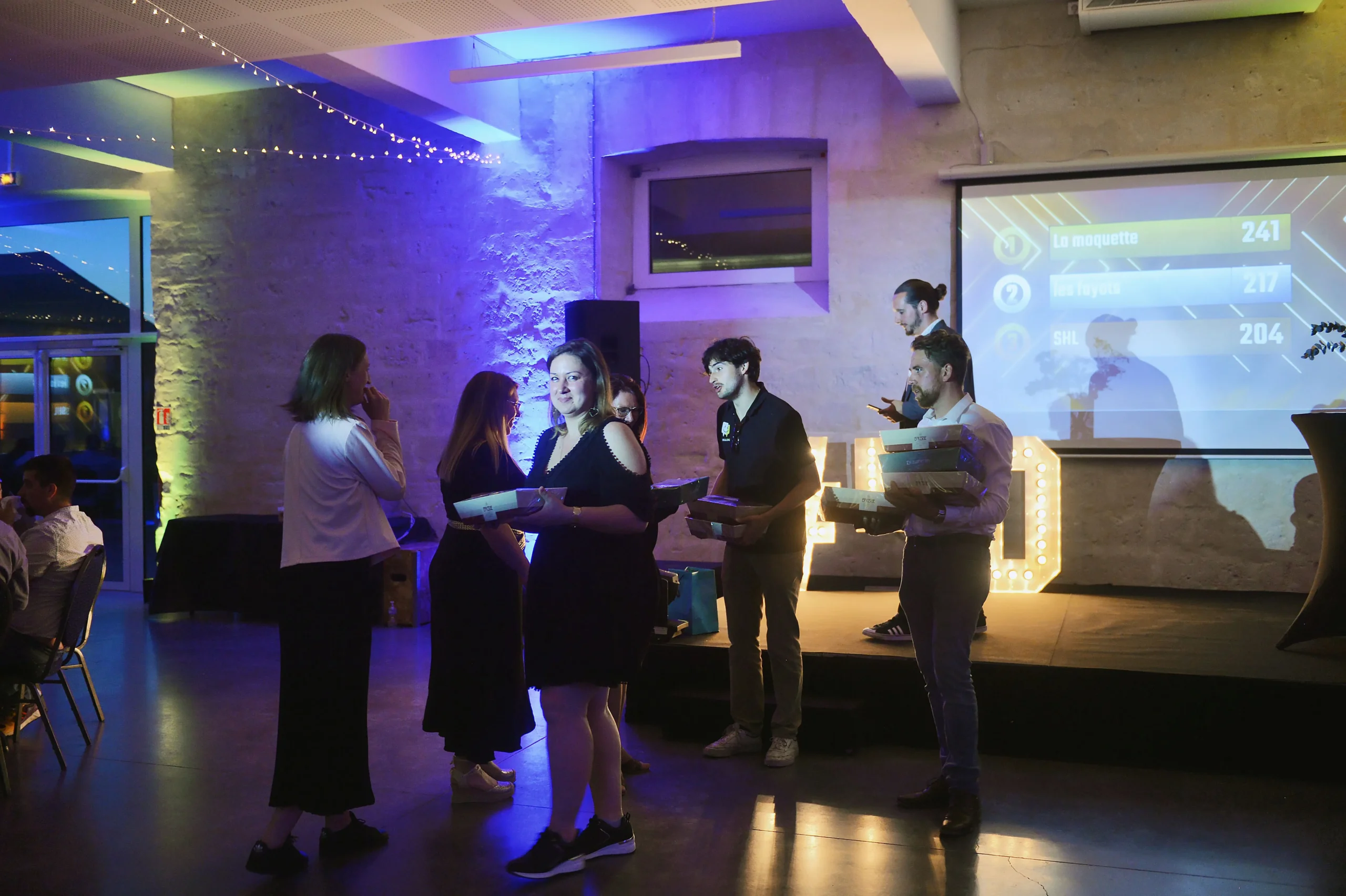 Corporate event communication Quebec product launch lit stage · INNOV'events