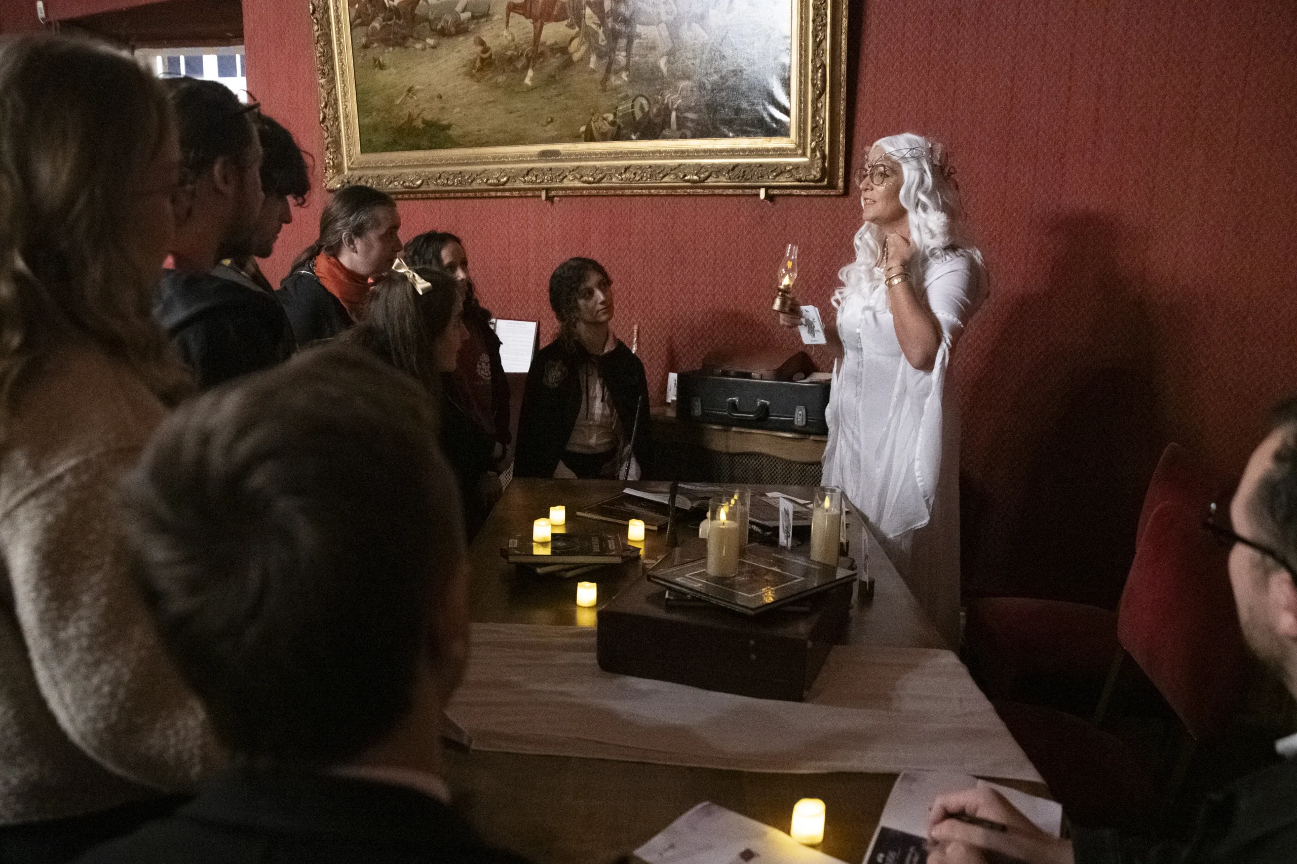 Corporate team working through a puzzle during an immersive murder mystery evening in Montreal · INNOV'events