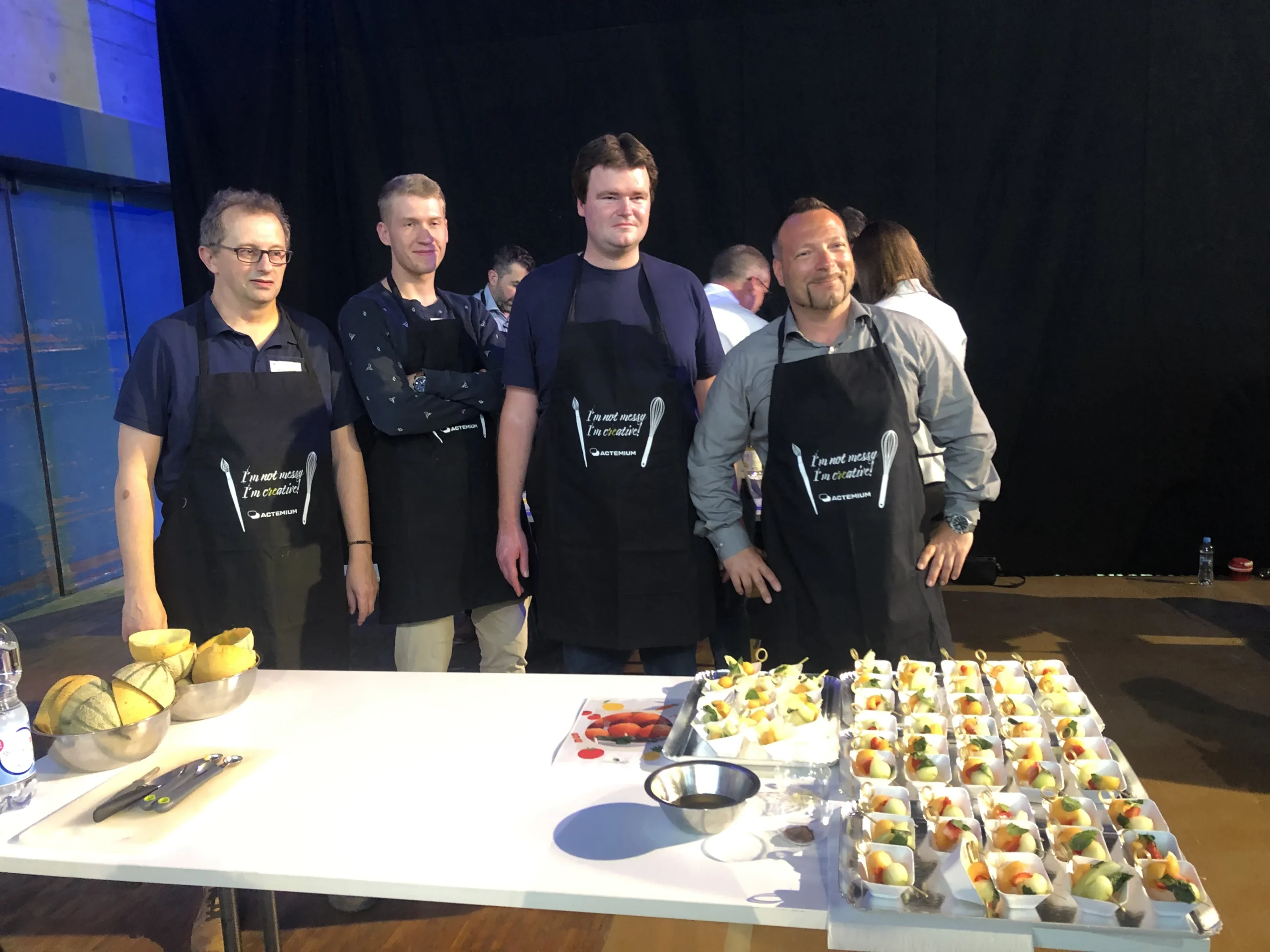 MasterChef-style culinary workshop in Laval, teams competing in a banquet hall · INNOV'events