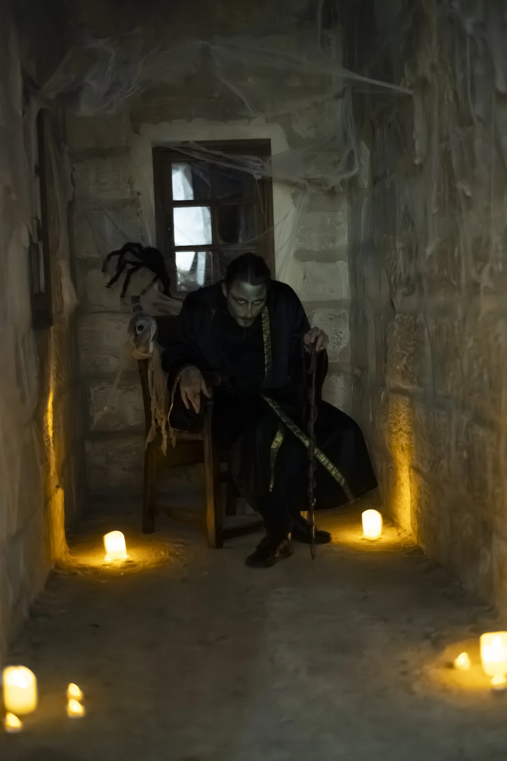 Corporate Halloween in Montreal decorated hall with pumpkins and black draping in the Quartier des spectacles · INNOV'events