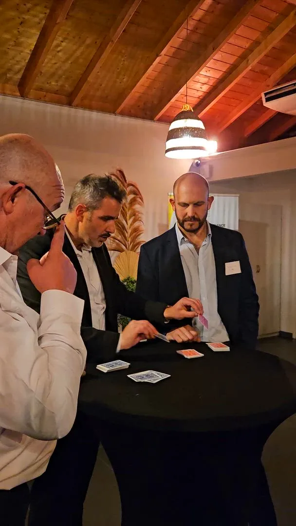 Stage magic act at a corporate event in Laval, lit conference hall · INNOV'events